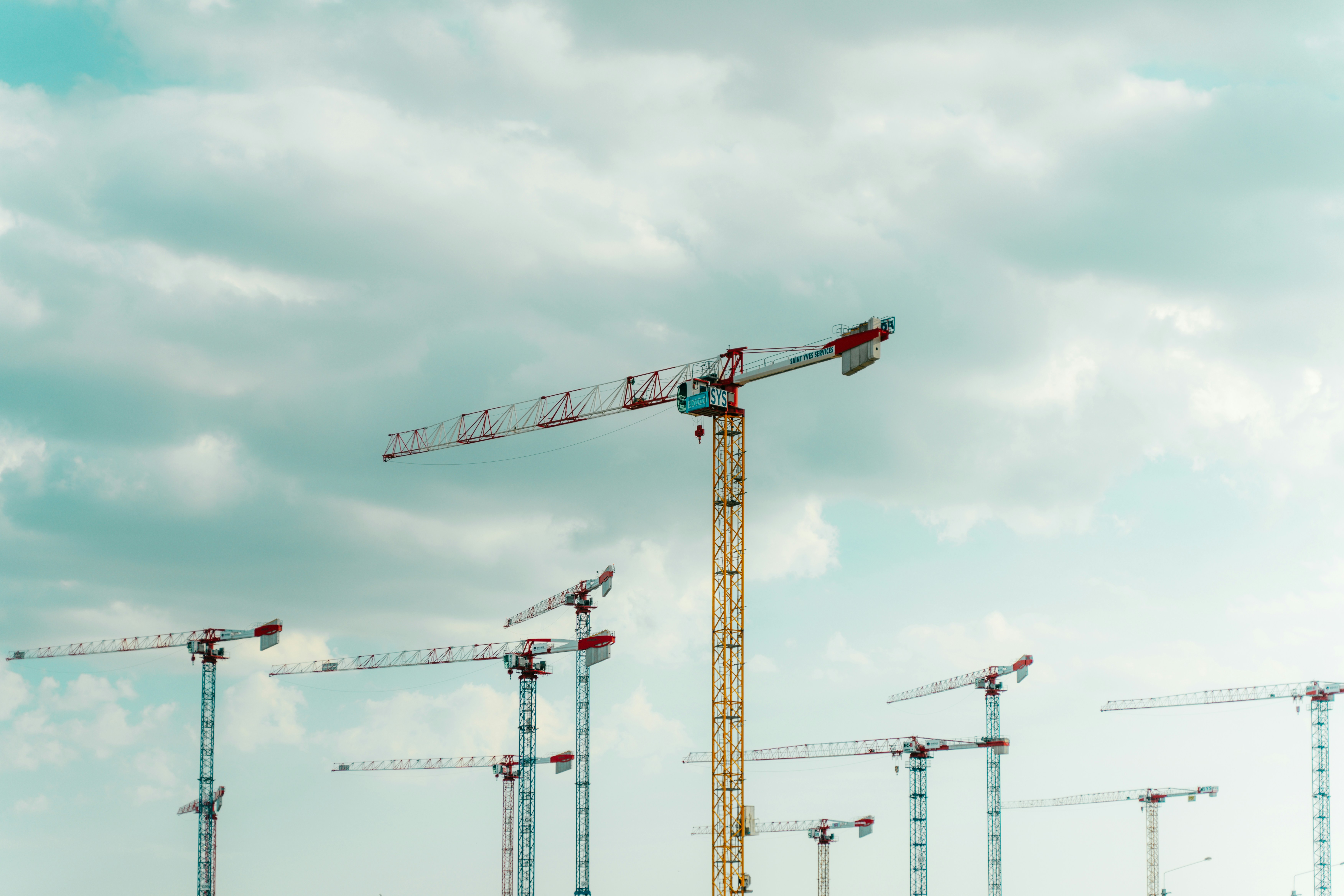 Construction site monitored by surveillance cameras and drones